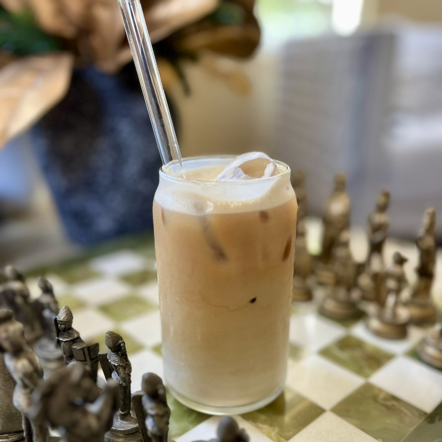 Iced latte on chess board